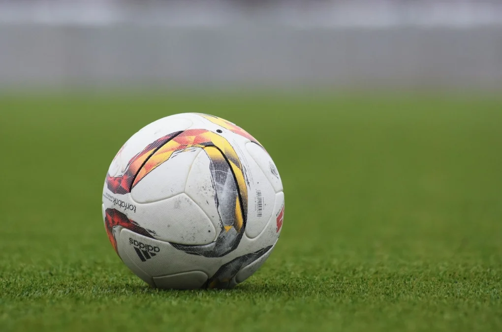 Cristiano Ronaldo success story starts with a simple ball on a field, representing his humble beginnings.