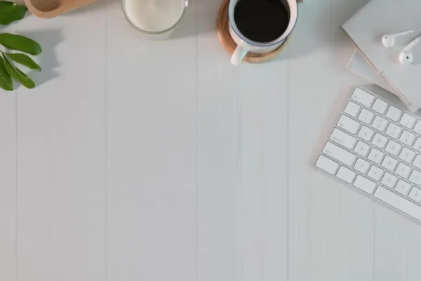 Why Minimalism Is Winning 2025: The Surprising Power of Less "Minimalism workspace with coffee, candle, and keyboard"