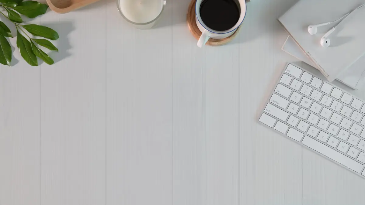 "Minimalism workspace with coffee, candle, and keyboard"